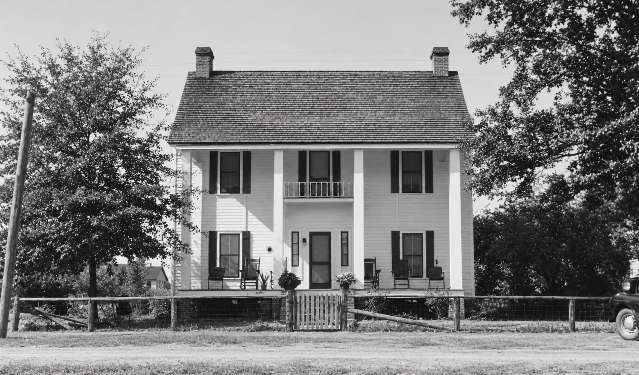 Black-and-white photograph of the two-story Barney Hotel