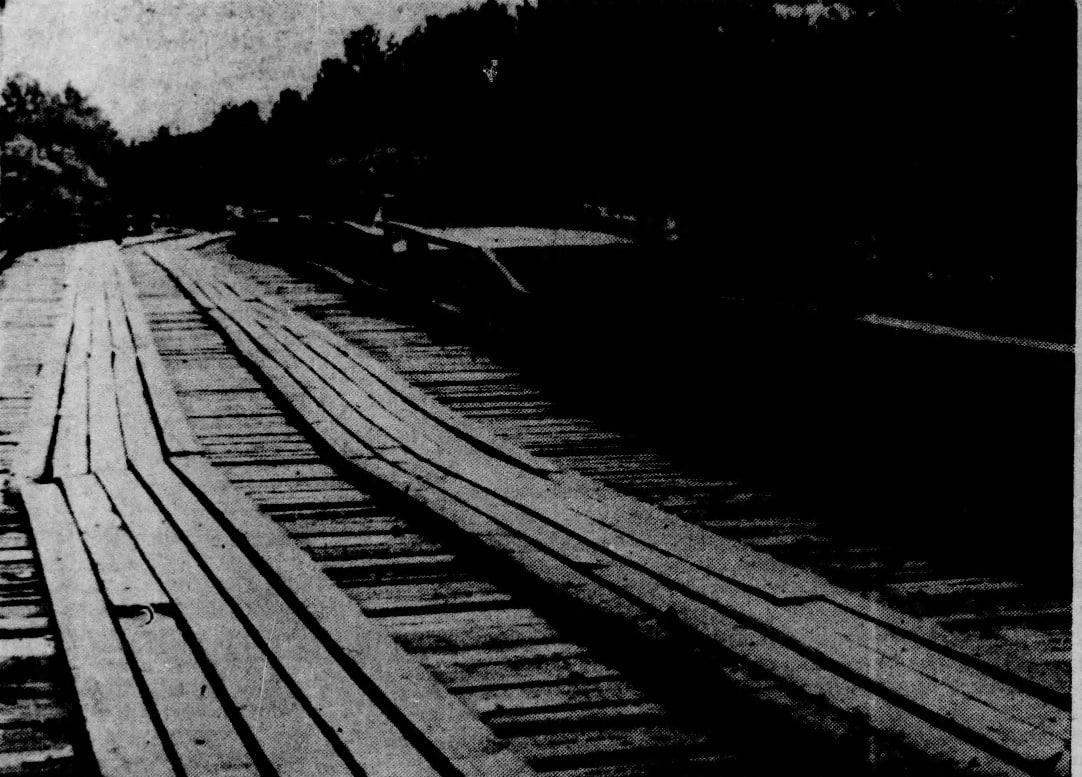 Temporary wooden bridge beside the wreckage of the concrete slough bridge